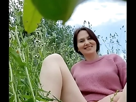 naked horny milf in a chamomile field masturbates, pisses and wards off a wasp / angela-milf
