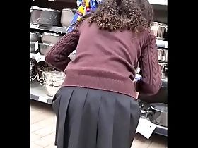 spying teen girl at supermarket - short skirt
